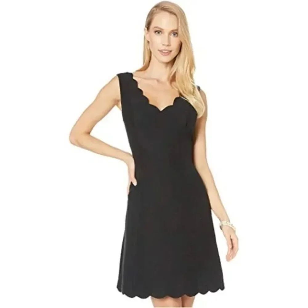 Connected Apparel black dress with scalloped sleeves and chest size 8